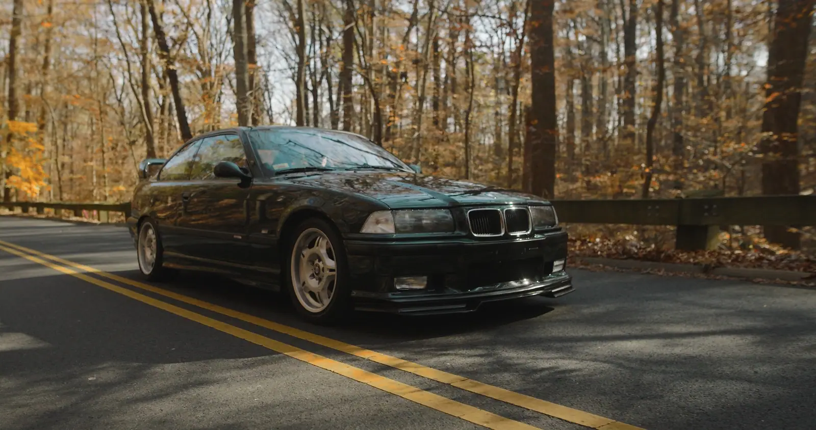 The M3 on a road through the autumn trees